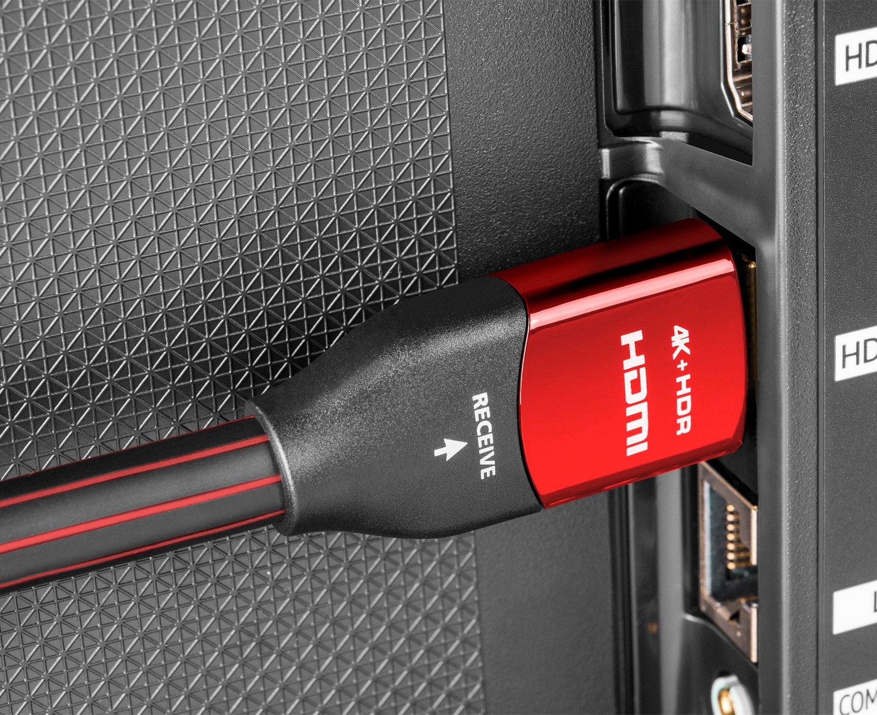 AudioQuest active HDMI cable plugged into the back of a TV