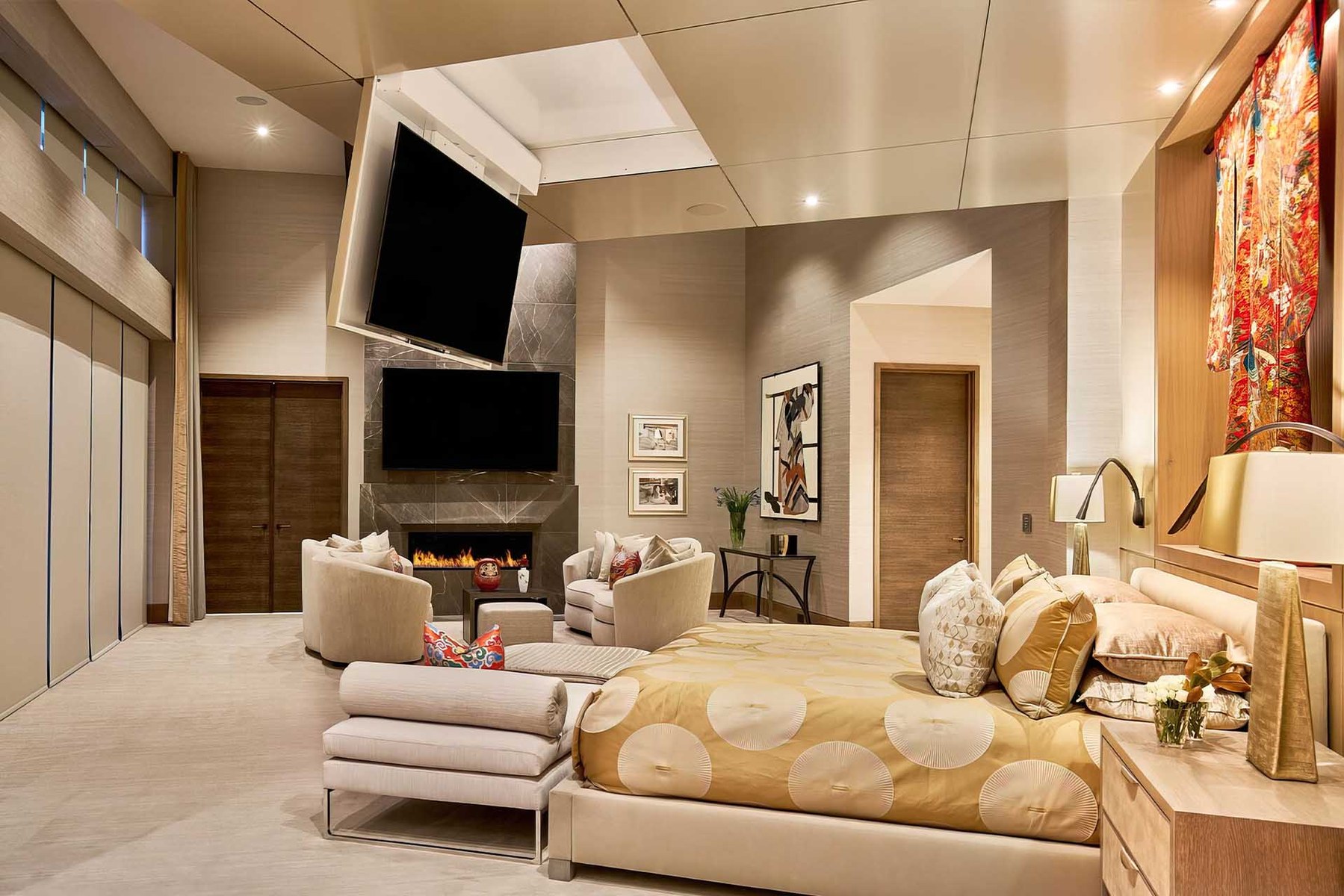 Future Automation ceiling hinge lowering a TV from the ceiling in a living room