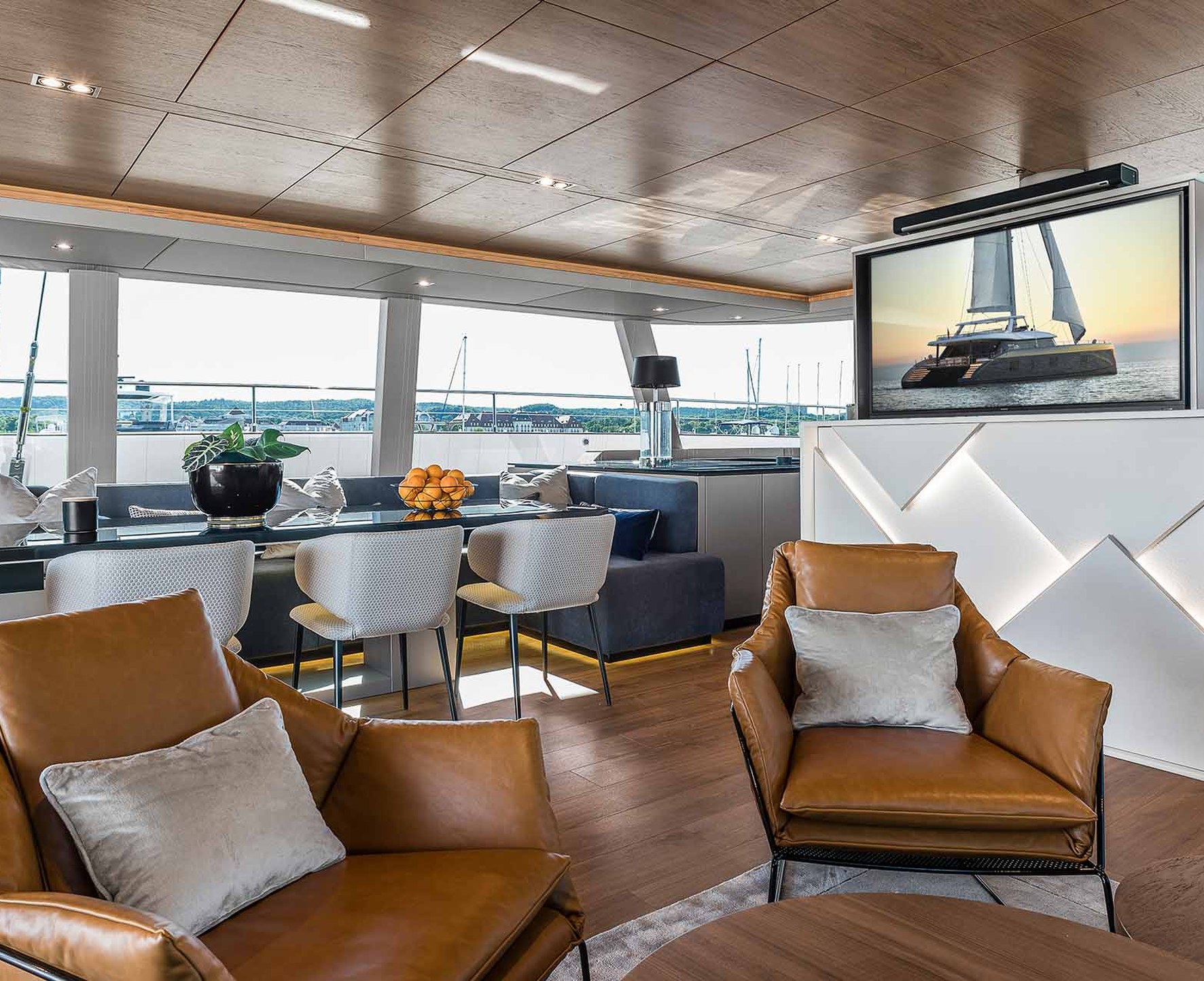 Future Automation TV lift raising a screen from a cabinet in a waterfront lounge