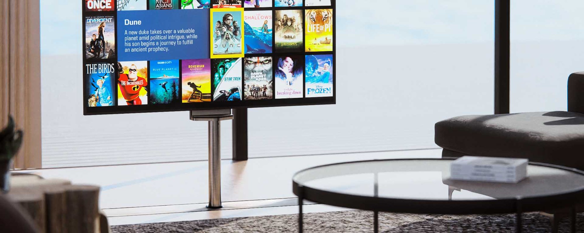 Future Automation in-floor TV lift with the screen raised in a living room