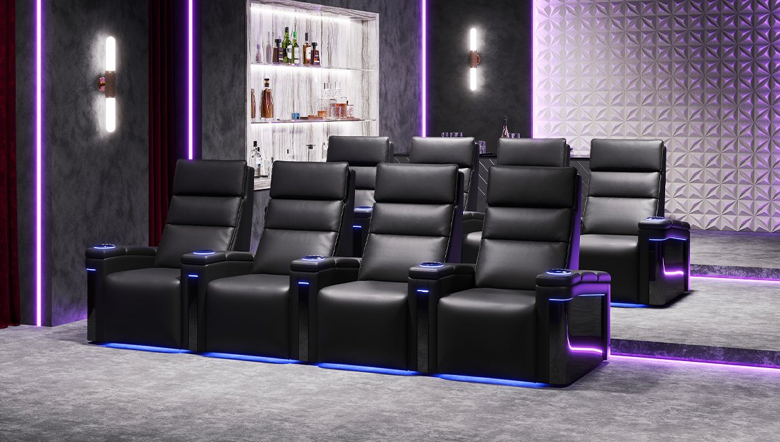 Row of Valencia Monza recliners with LED base lighting in a home theatre