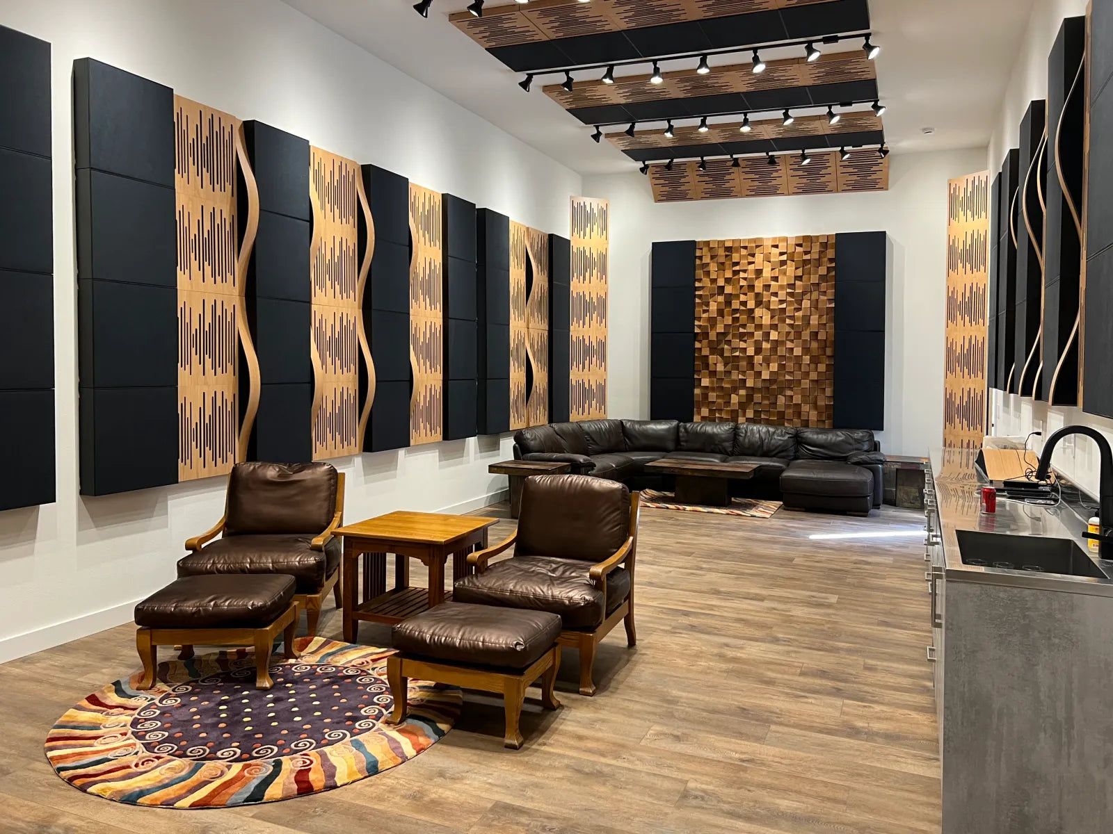 Large media room with Vicoustic Wavewood panels and acoustic absorbers along the walls