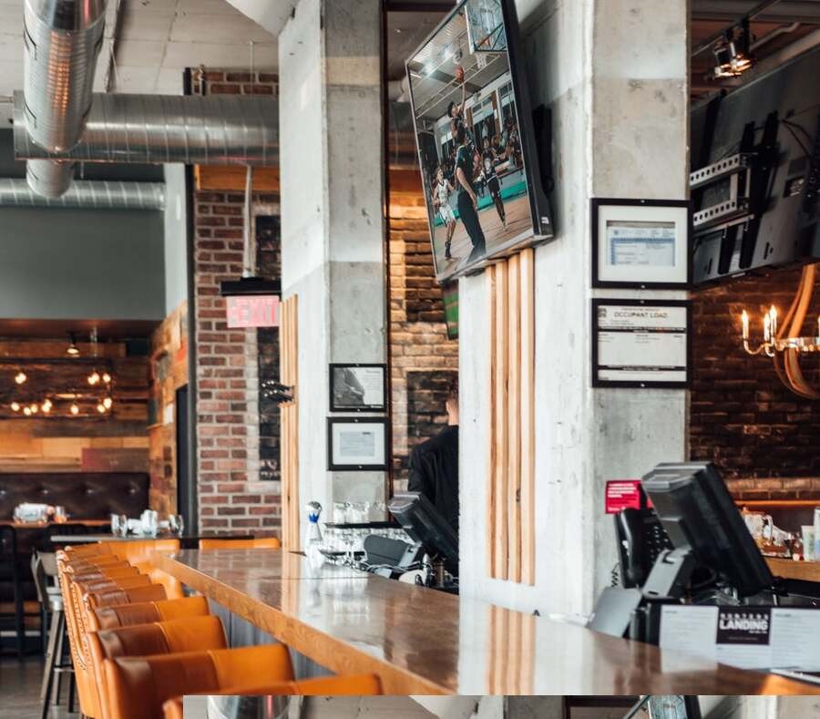 A restaurant bar featuring a TV and audio distribution for the space.