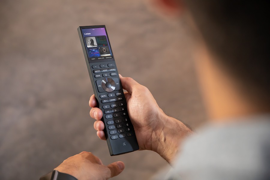 A Control4 Universal Remote playing music.