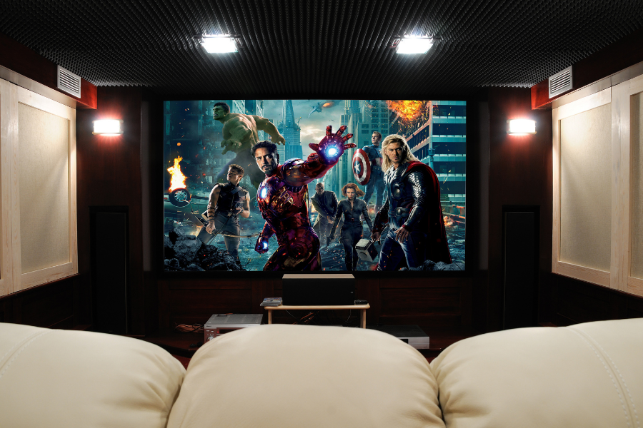 Beautiful home theatre design with The Avengers playing on the screen. 