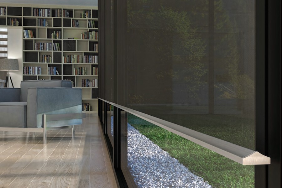 An elegant home office/den in an Ottawa home with Lutron Palladiom shading.