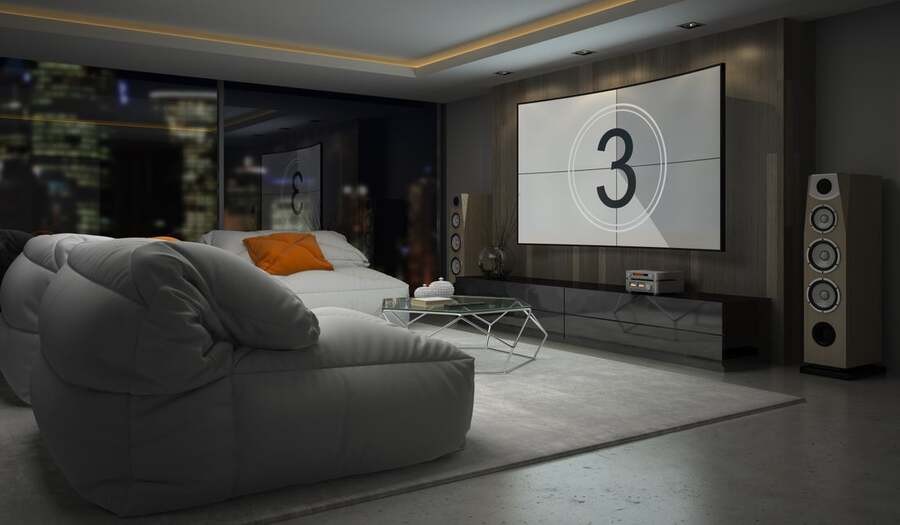 A luxury home theatre with a high-end projector and top-level speakers.