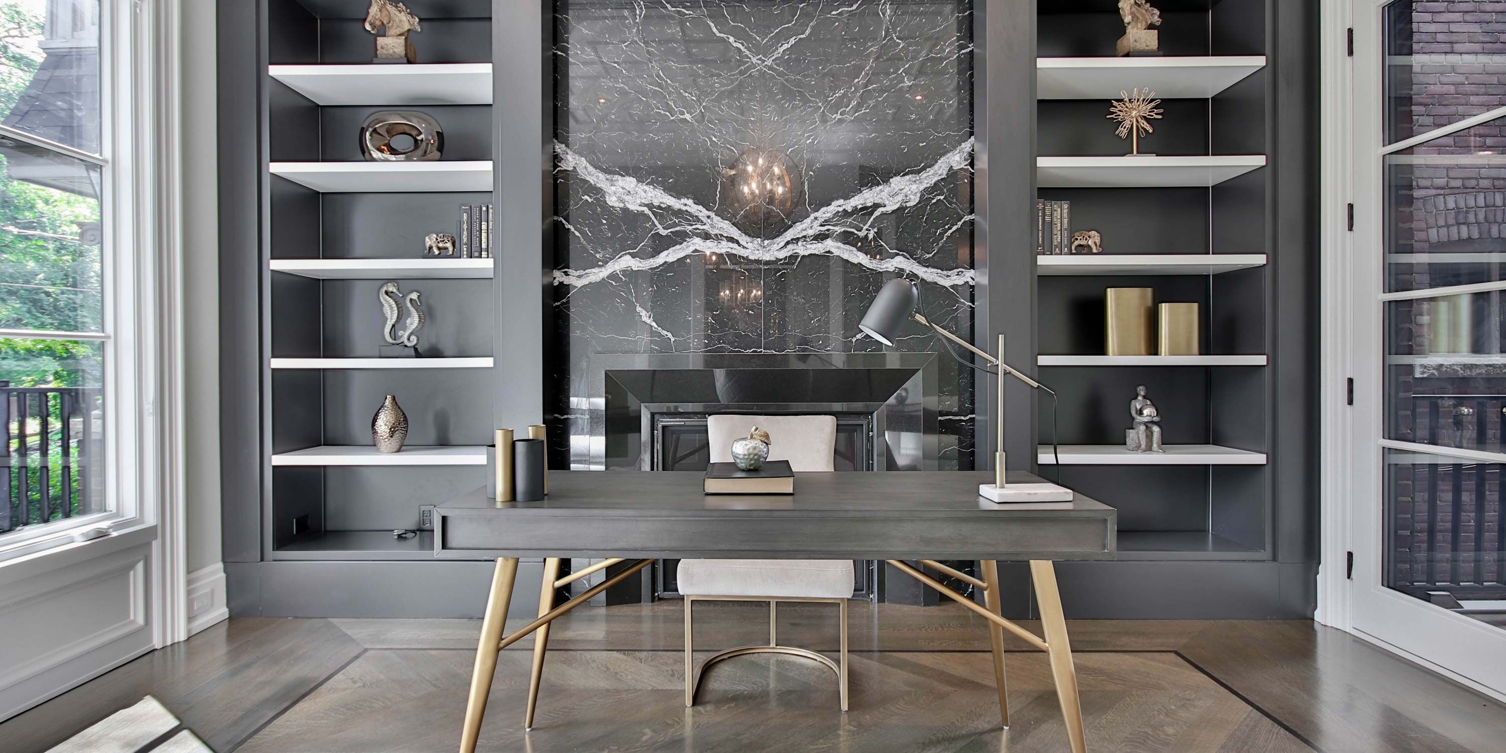 grey colored home office with metallic knick knacks on shelves