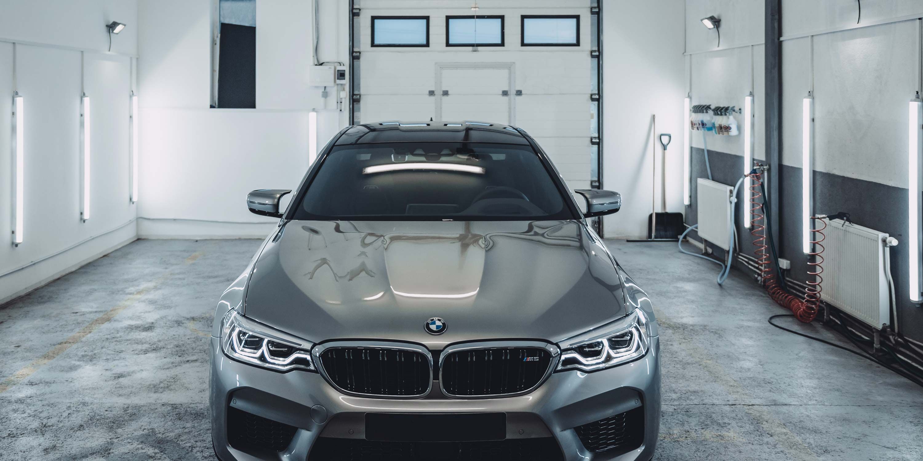 BMW in grey garage