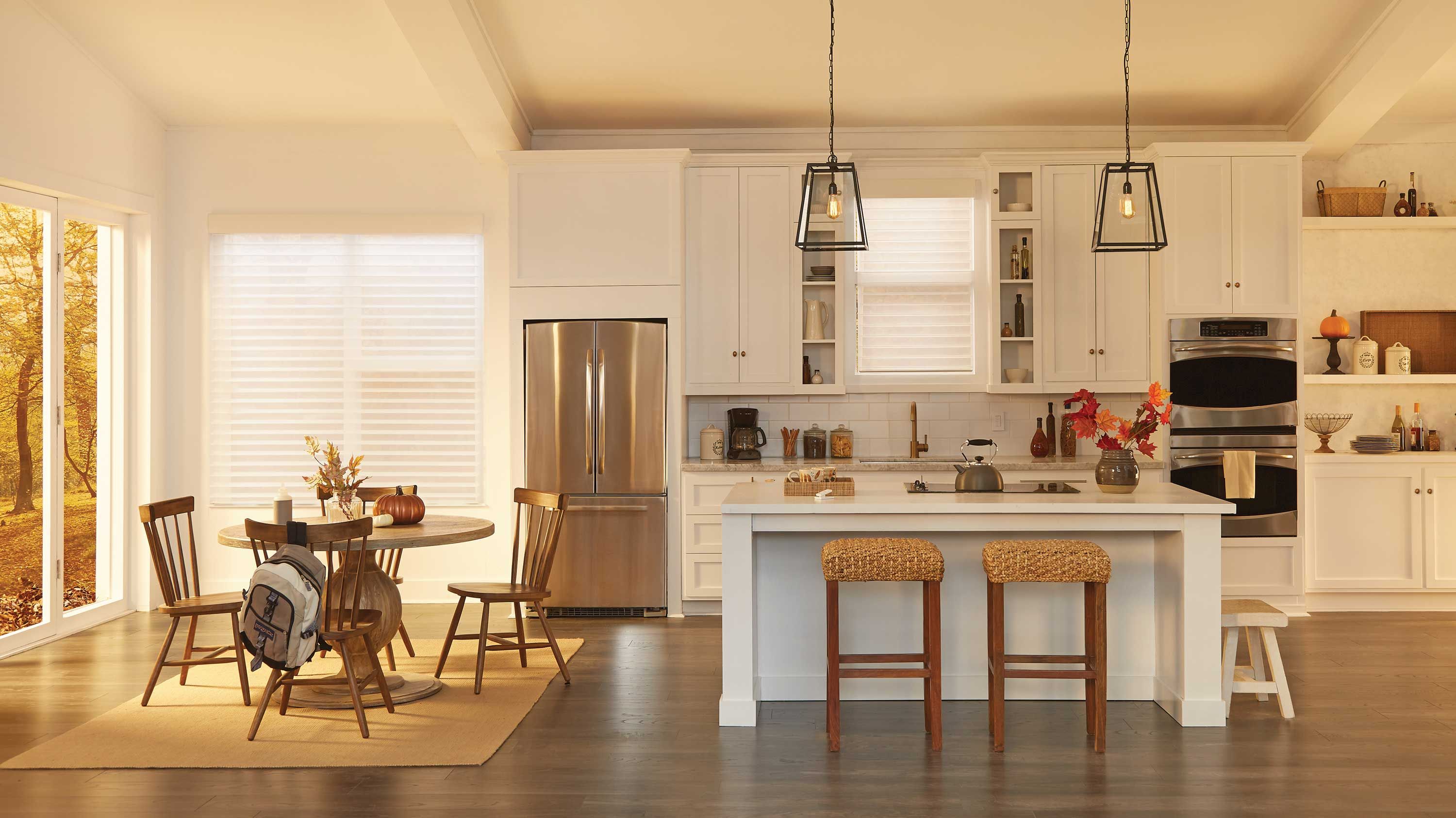 warm toned kitchen with lutron lighting and shading